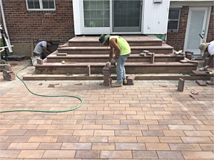u shape flared back patio porch groutless verona nicolock golden brown smooth plank paver wood look bullnose jericho